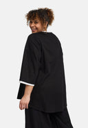 'Saria' Blouse – asymmetrisch, licht & natuurlijk